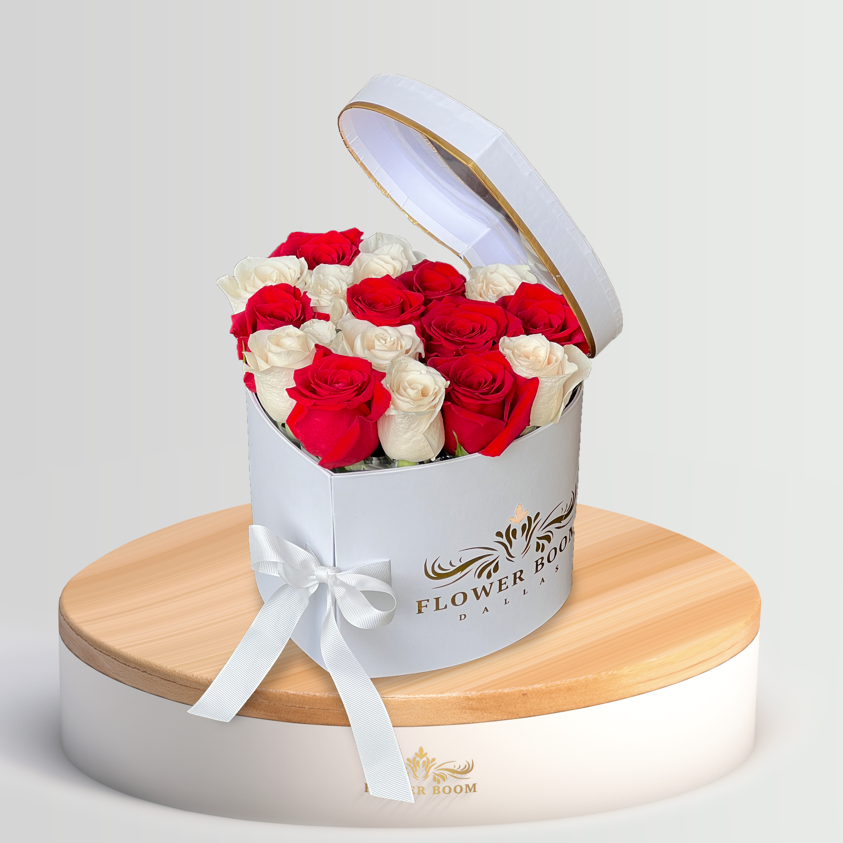 white and red roses in a white two tier heat shaped box by Flower Boom Dallas