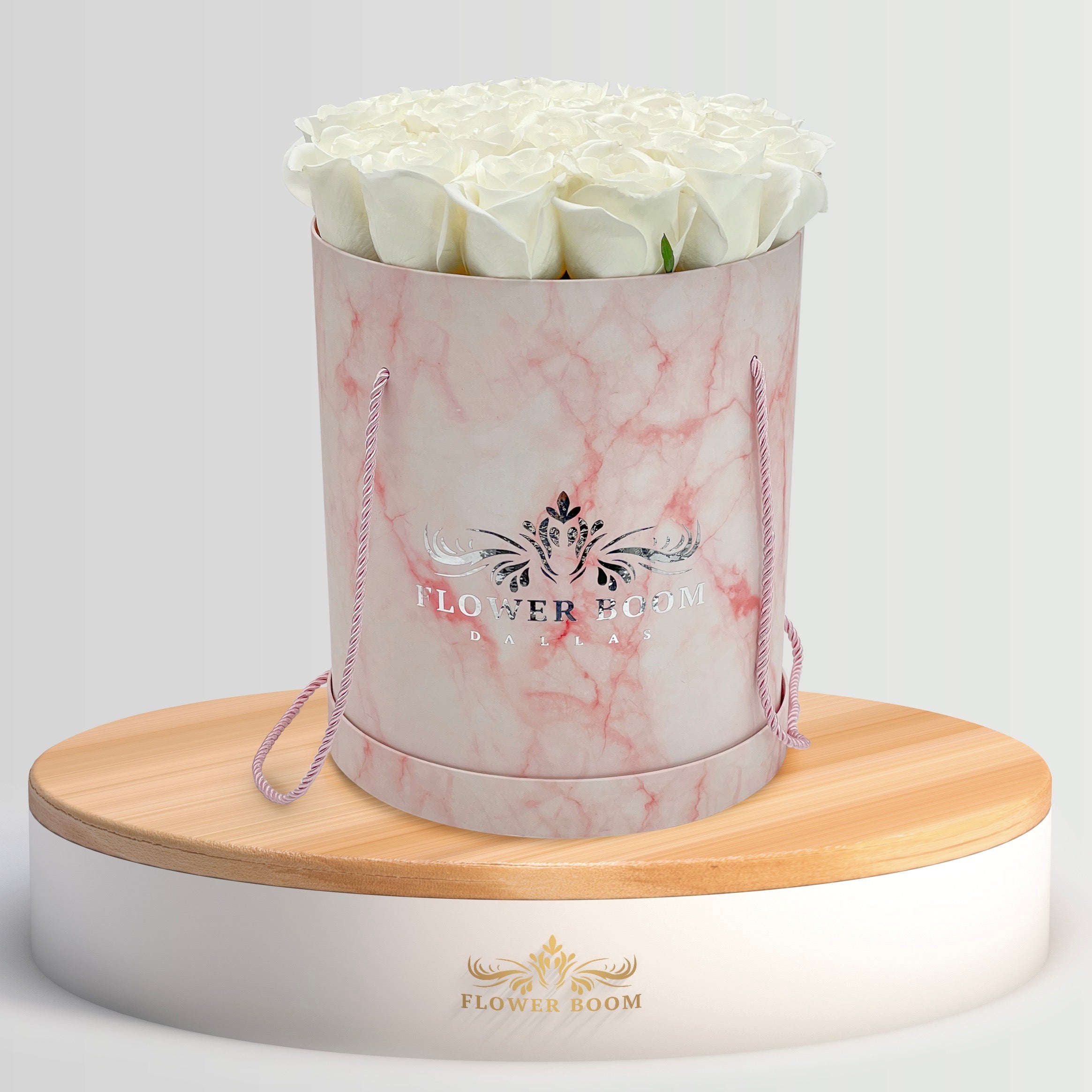 white roses in pink marble box