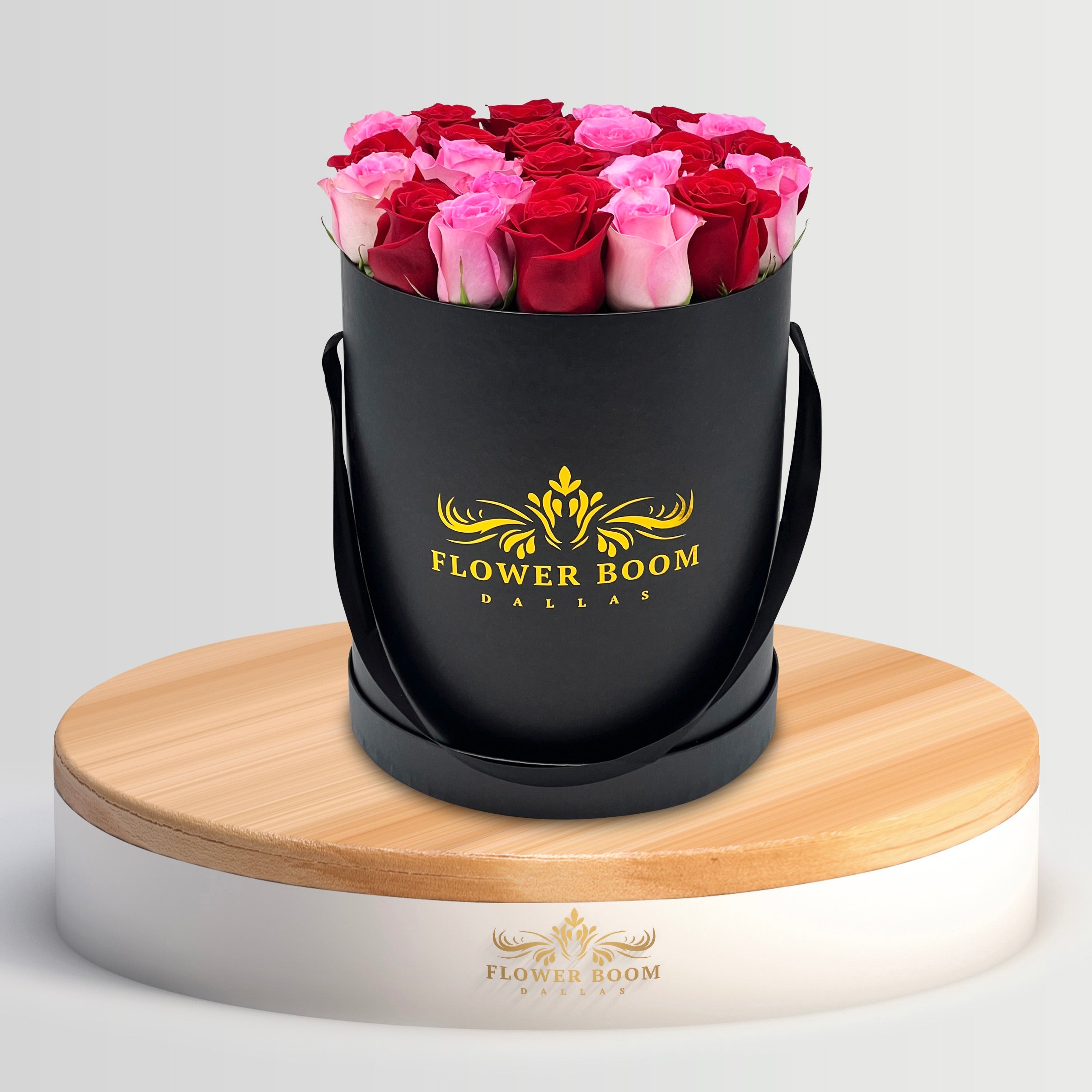 25 red and pink roses in a black box